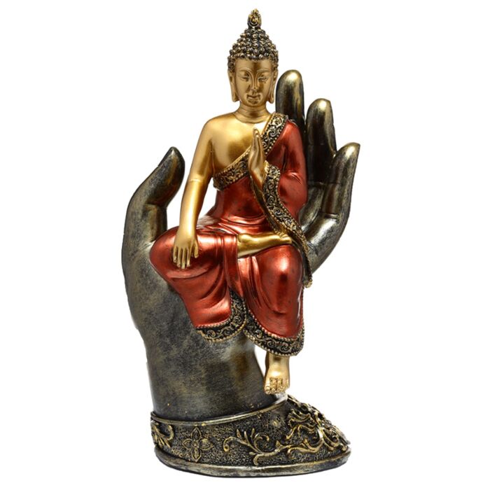 Goldener und roter Thai-Buddha in einer Hand sitzend